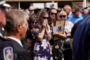 Sams widow, Megan wipes away tears as she watches the casket being loaded into the hearse during the funeral of NSW RFS volunteer firefighter Samuel McPaul at Holbrook Sports Stadium in Albury, NSW, Australia. McPaul died while he was fighting the Green Valley blaze on December 30. Getty Images