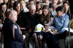 NSW Fire Commissioner Shane Fitzsimmons presenting awards to Sams widow Megan, and mum, Christine during the funeral of NSW RFS volunteer firefighter Samuel McPaul at Holbrook Sports Stadium in Albury, NSW, Australia. McPaul died while he was fighting the Green Valley blaze on December 30. Getty Images